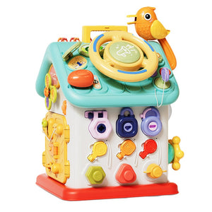 Montessori Busy House toy for toddlers featuring doors, buttons, switches, and lights for fine motor skill development