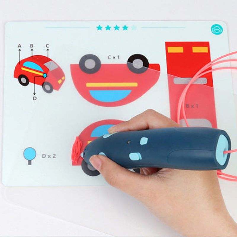 Child using 3D Magic Pen Set to create a red car design on a stencil drawing board
